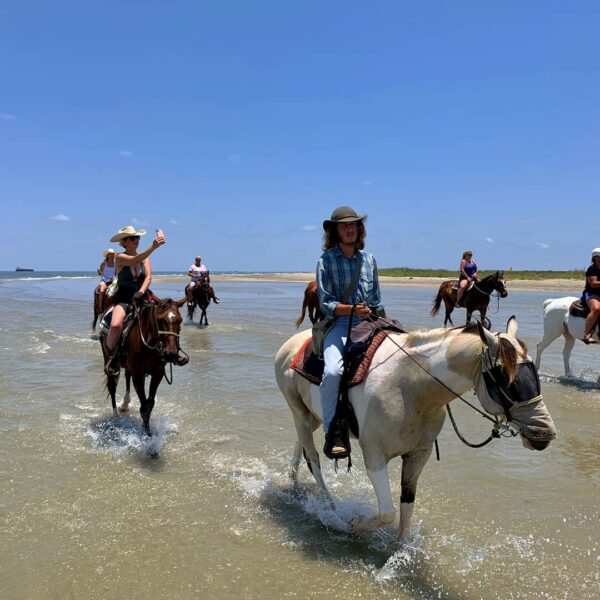 riding horses on beach